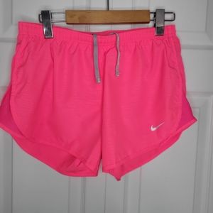 Bright pink Nike Dri-Fit running shorts